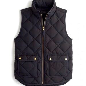 J Crew quilted vest in black with gold zipper and gold hardware pockets. Size XS